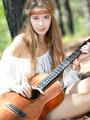 Erica B plays her guitar in the nude